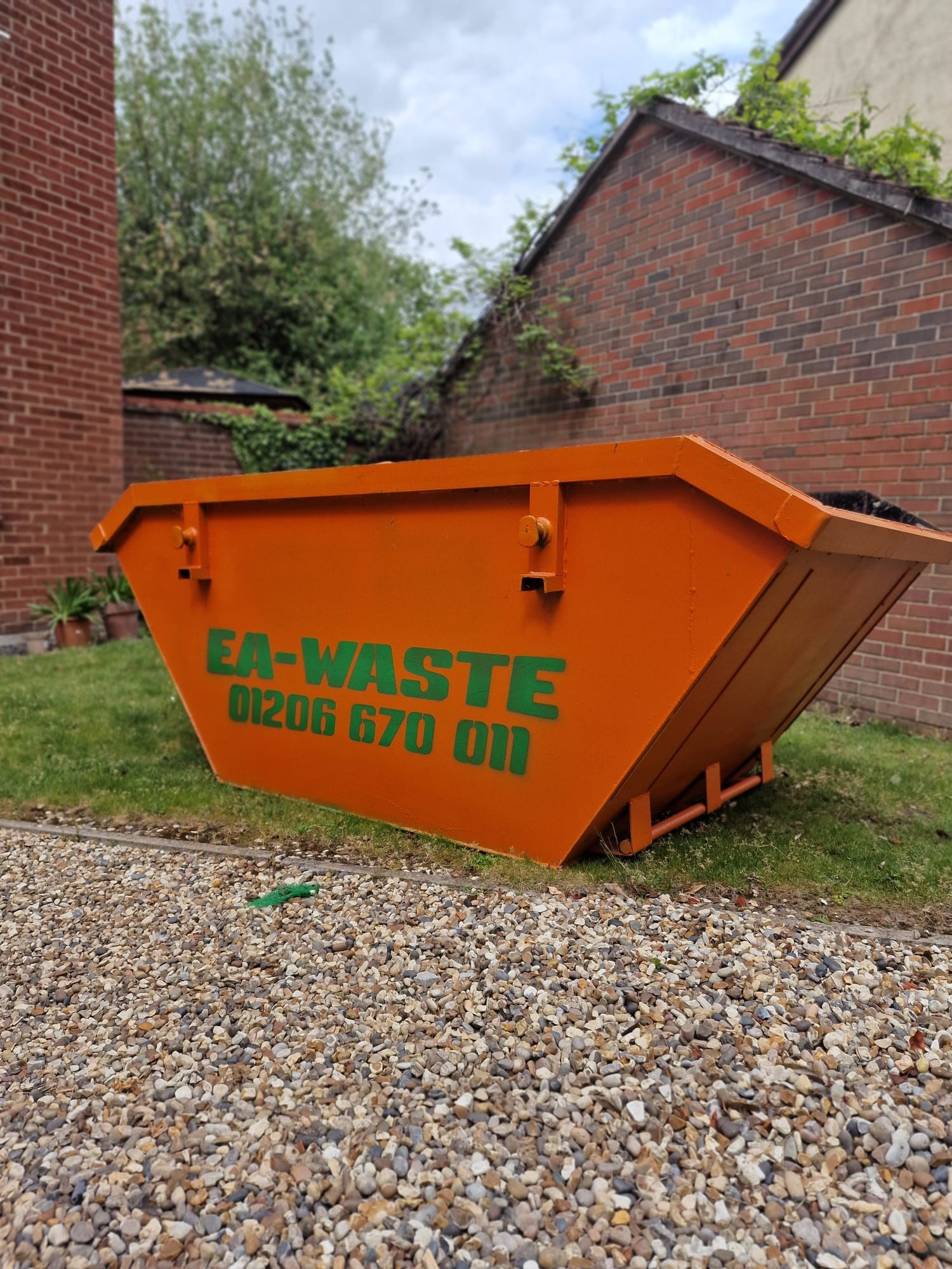 4 yard midi skip for hire by EA Waste on a residential driveway.